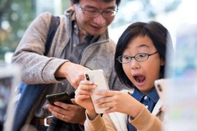 Girl and Dad with Apple iPhone X